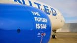 United Airlines aircraft with the words "The Future is SAF" on the engine